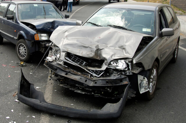 Two vehicles with smashed front end involved in a car accident 