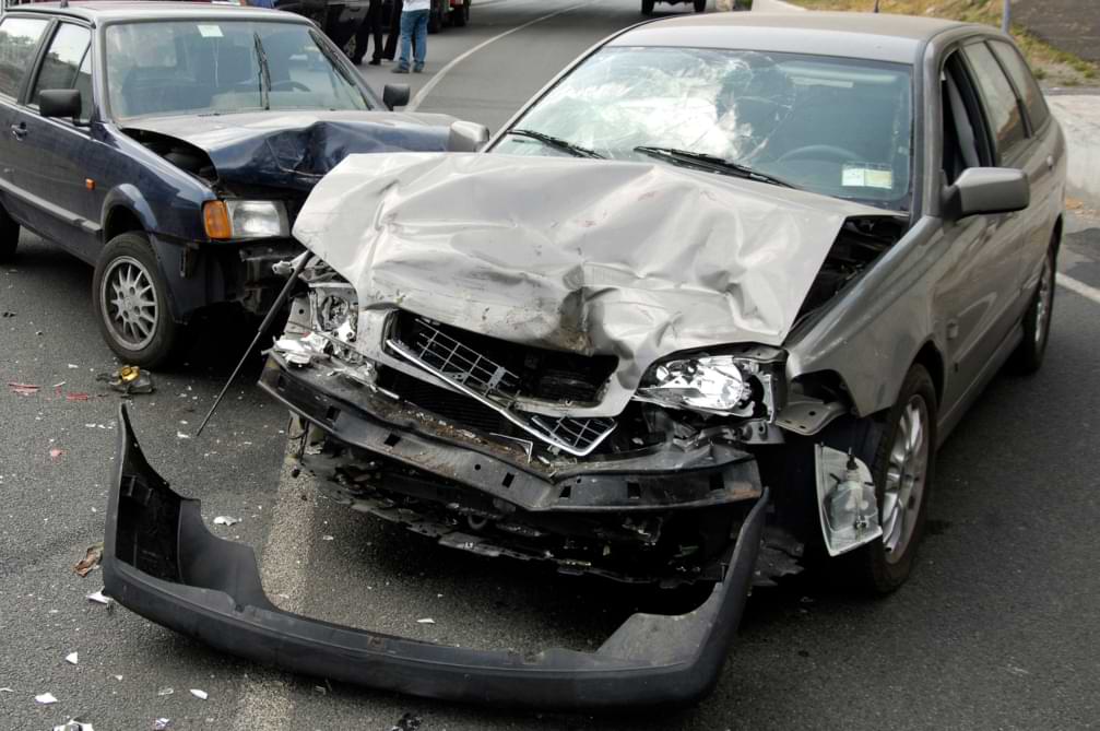  two cars involved in a T bone car accident with major front end damage