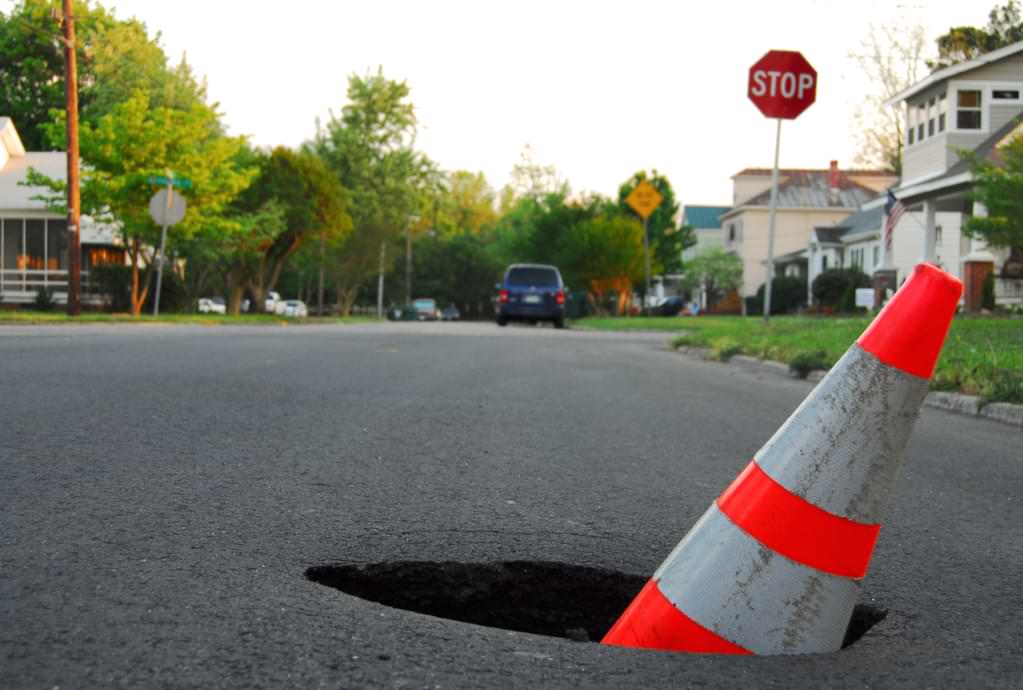 Sinkhole in Florida road.